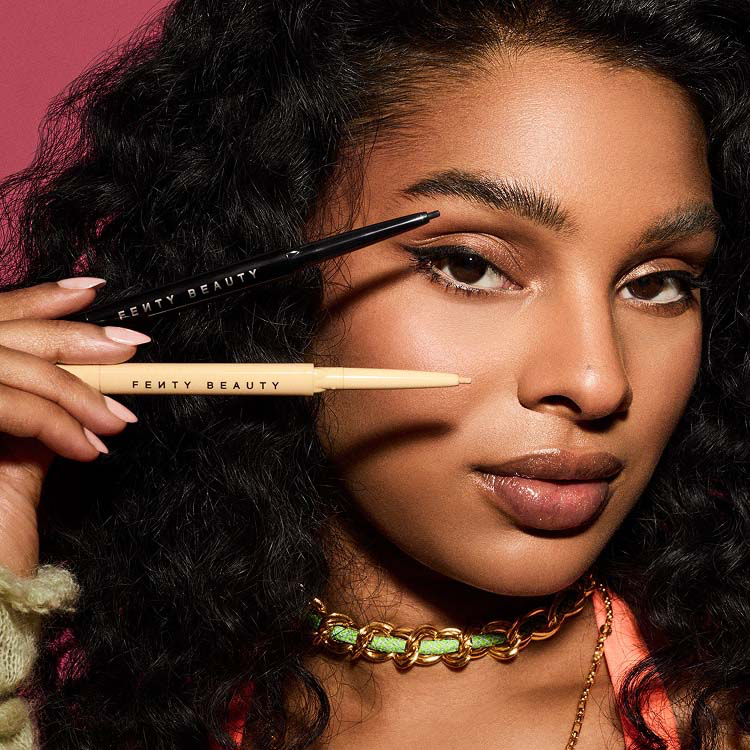 Fenty Beauty eye makeup collection featuring mascaras, eyeliners, and eyeshadows arranged on a clean background.